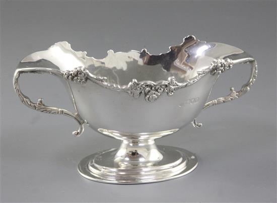 An Edwardian silver two handled double lipped sauce boat, Height 90mm weight: 6.6oz/206grms.